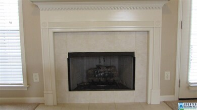 Ventless gas longs in tiled surround fireplace