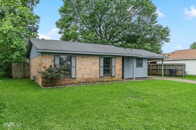 Ranch-style house featuring fence, a carport, a fr