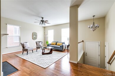 Front entrance with hardwood floors and windows ov