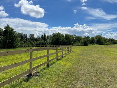 The new fence follows the easement and southern property line. There is a barbed wire fence along the western side.
