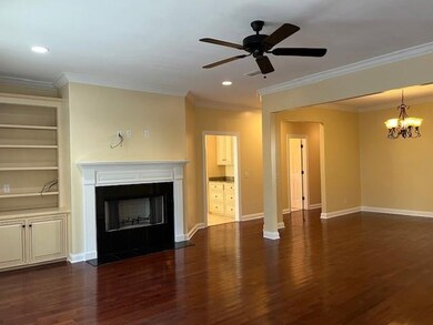 Living room with wood burning fireplace.