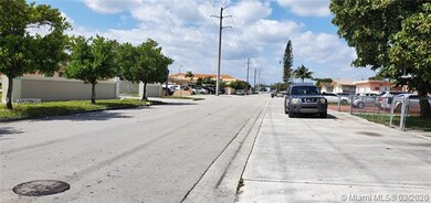 Street view of E. 10th St. looking west to Palm Av