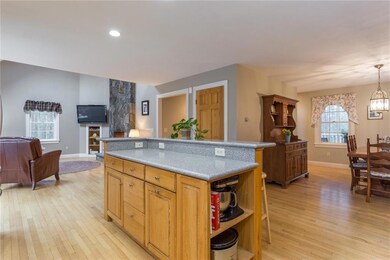 Open-concept kitchen, living, dining...