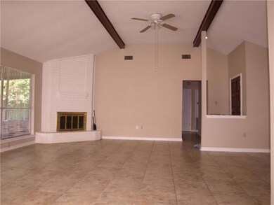 Den with vaulted ceiling, ceramic tile floors and
