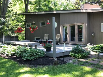 Large back deck overlooking fenced in backyard. Ve