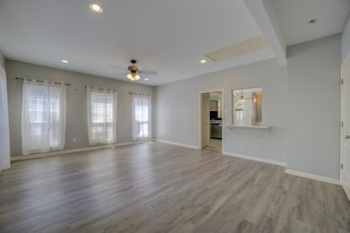 Unfurnished living room featuring light hardwood /