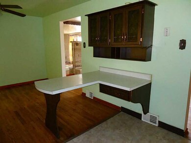 Kitchen. Breakfast bar offers more seating.