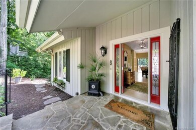 Beautiful front entry into lead glass doors. Slate