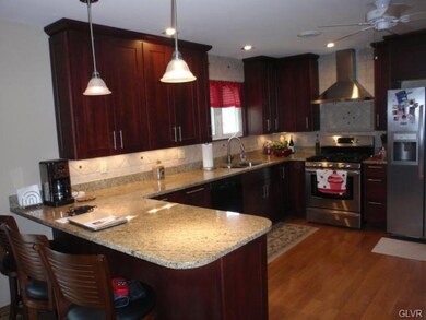 Another view of the kitchen, note the hardwood flo