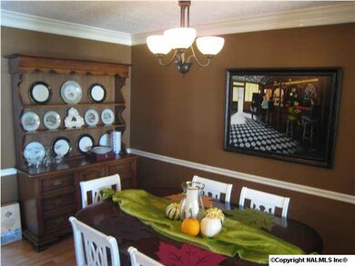 Formal ding room with hardwood floors and cutom mouldings