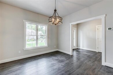 Formal Dining Room has Beautiful Floors & Chandeli