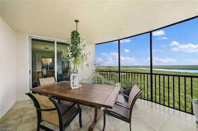 Sunroom / solarium featuring a water view and a we