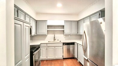 Kitchen featuring sink, light hardwood / wood-styl