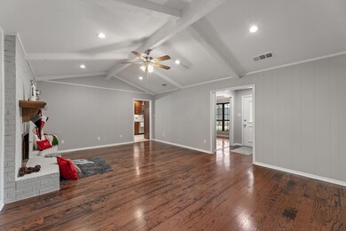 Living room with dark hardwood / wood-style floori