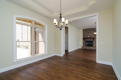 View from the foyer into formal Dining Room and Hearth/Gathering Room.