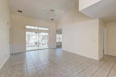 Unfurnished room with a ceiling fan, light tile pa