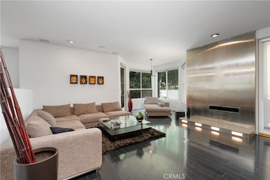 Living room w/custom built FPLC & sitting area