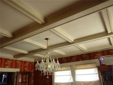Dining room with coffered ceilings with Italian ch