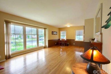Beautiful original wood floors greet you at the en