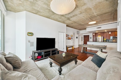 Living room featuring wood finished floors and bi