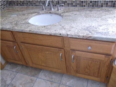 Master bath has double vanity, new granite tops an