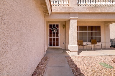 View of exterior entry featuring stucco siding