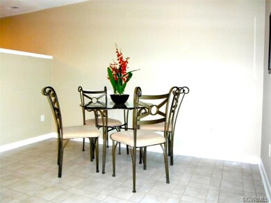 Eat in kitchen area with sliding glass doors to co