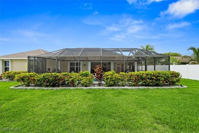 Back of property featuring glass enclosure and a y