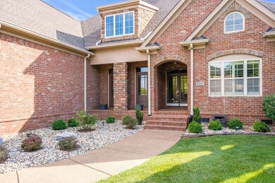 Covered front porch and double entry doors.