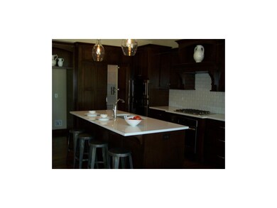 Large kitchen island, walk-in pantry, and double o