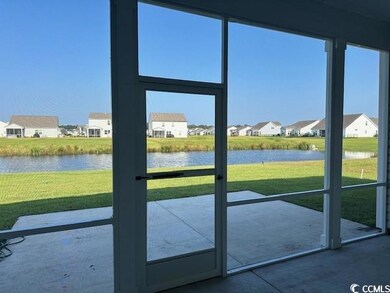 Entryway featuring a water view, concrete flooring