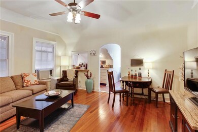 Generous size living room with serving window to t