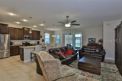 Great room open to Kitchen and triple sliders to P
