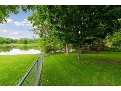Fenced side yard with great pond view.