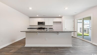 Kitchen featuring dark hardwood / wood-style floor
