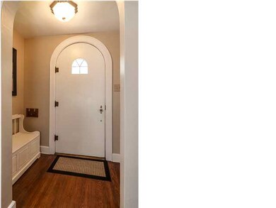Round top door at the foyer. Classic tutor style.