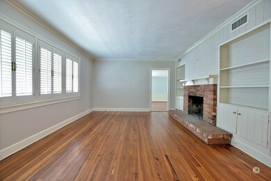 Living Room w/ Fireplace, Built Ins and Lots of Na