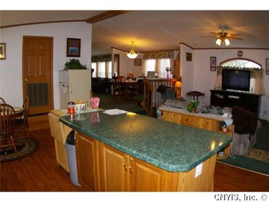 Kitchen an island bar, a eat in kitchen area and a