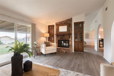 Fireplace is shared by two living spaces