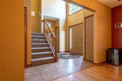 Beautiful Entry Foyer impressive with Cathedral ceiling and lots of natural sunlight.