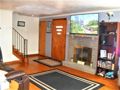 Enter into this huge living room featuring hardwoo