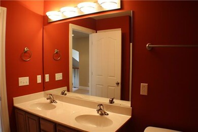 Guest bath with linen closet, double vanity, shower tub combo