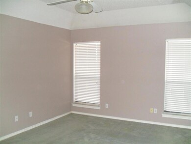 Empty room featuring a ceiling fan, baseboards, va