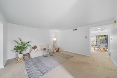 As you enter, you are welcomed by this spacious living room.