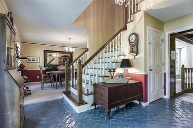 Lovely entry way with wide stairs leading to the 2