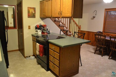 Open with new flooring and lighting.