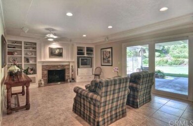 Warm stacked stone fireplace and granite hearth in