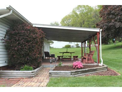 Exterior Back. brick porch and rubber roof