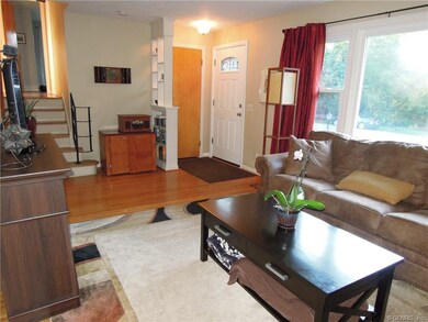 Spacious living room with hardwood floors.  The la