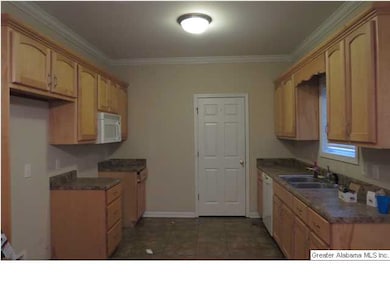 Galley style kitchen with access to laundry room